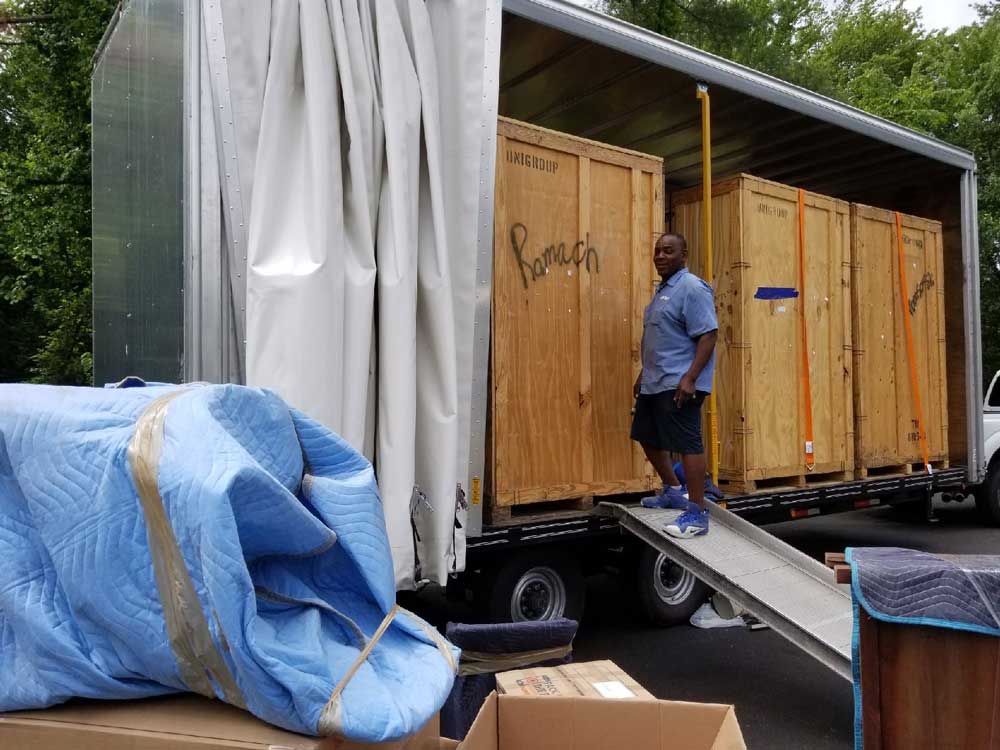 Professional Movers Organizing Packing Items