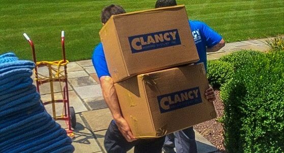 movers carrying boxes