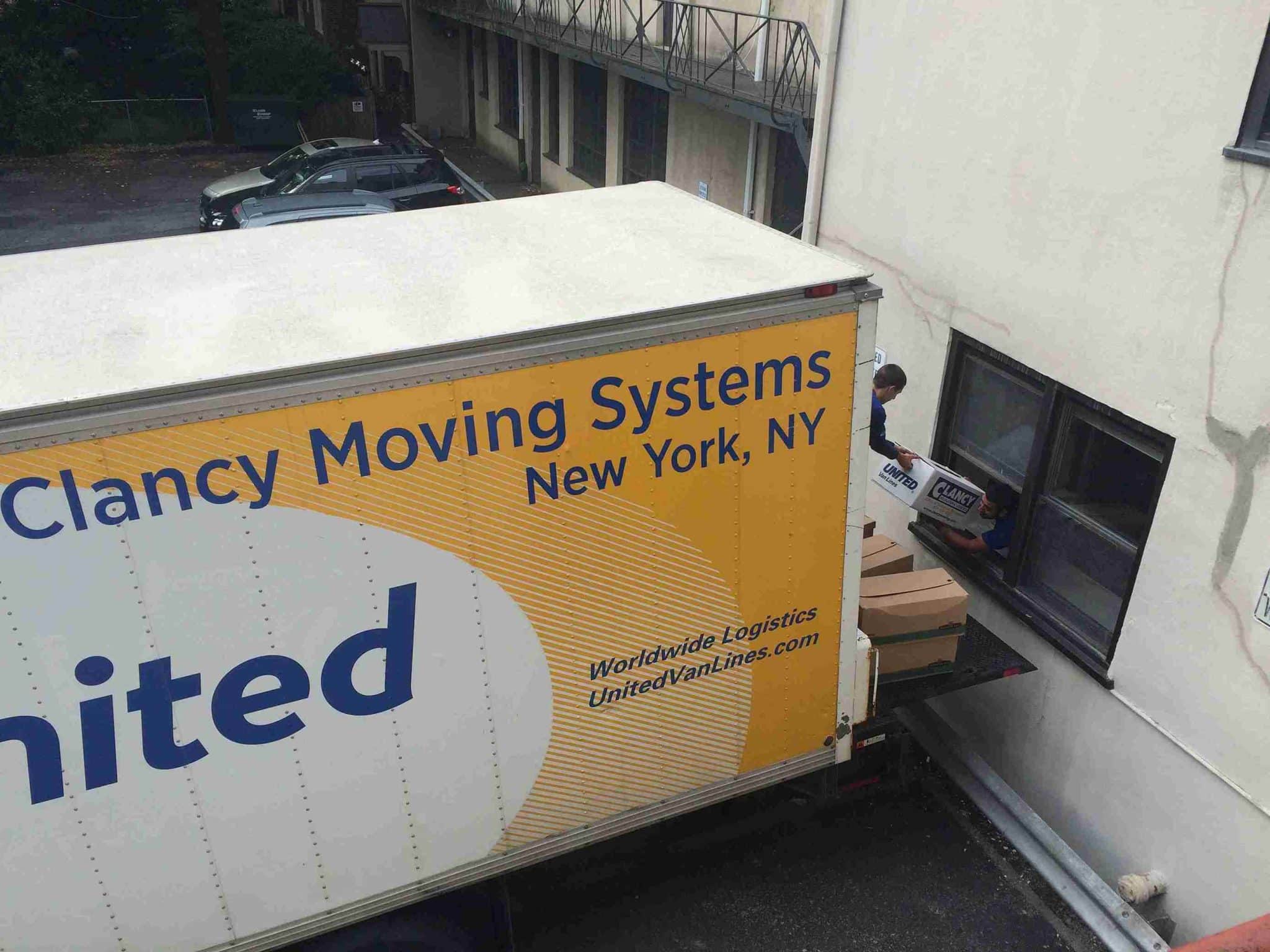 movers transferring the packages to the moving truck